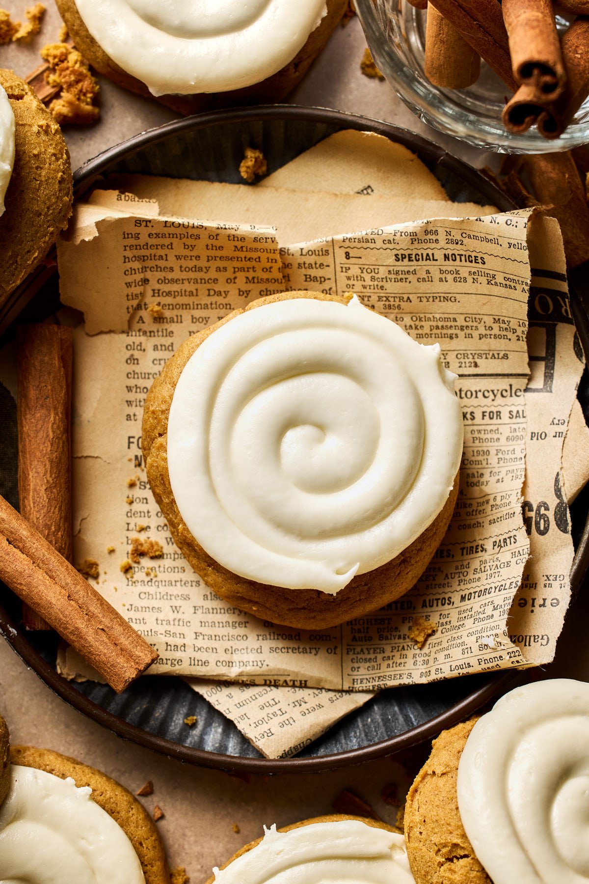 a single gluten free pumpkin cookie topped with icing 