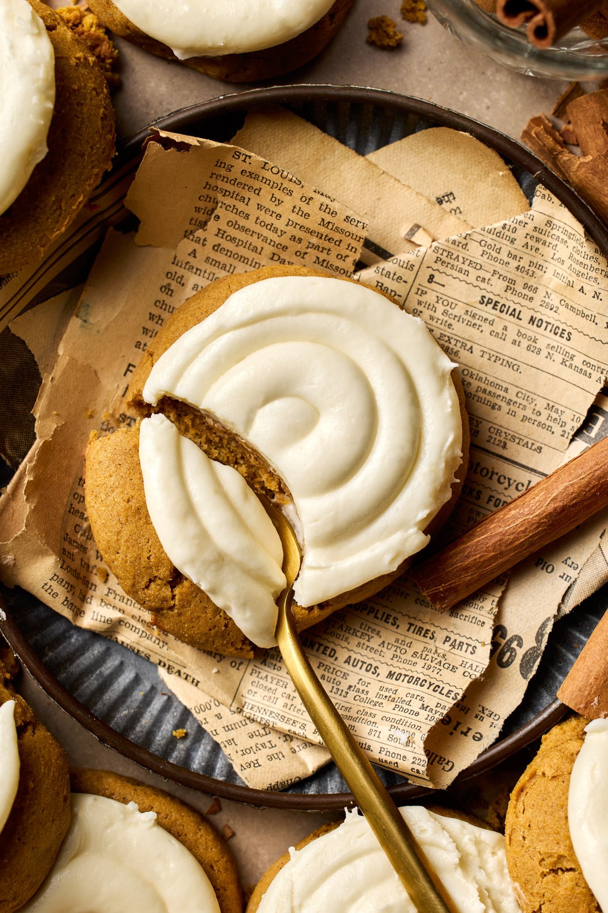 one frosted cookie with a fork cutting into it 