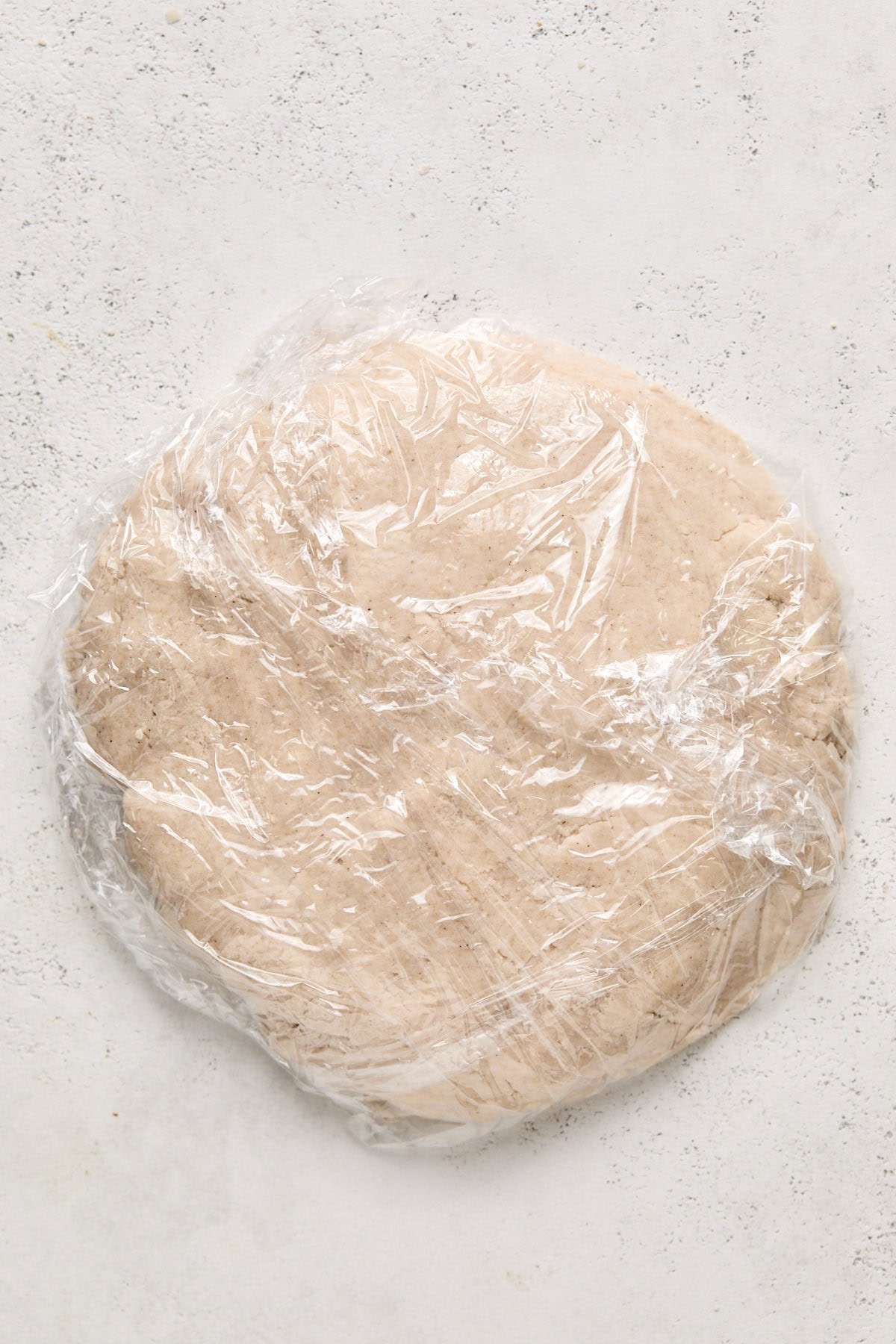 dough wrapped in plastic wrap 