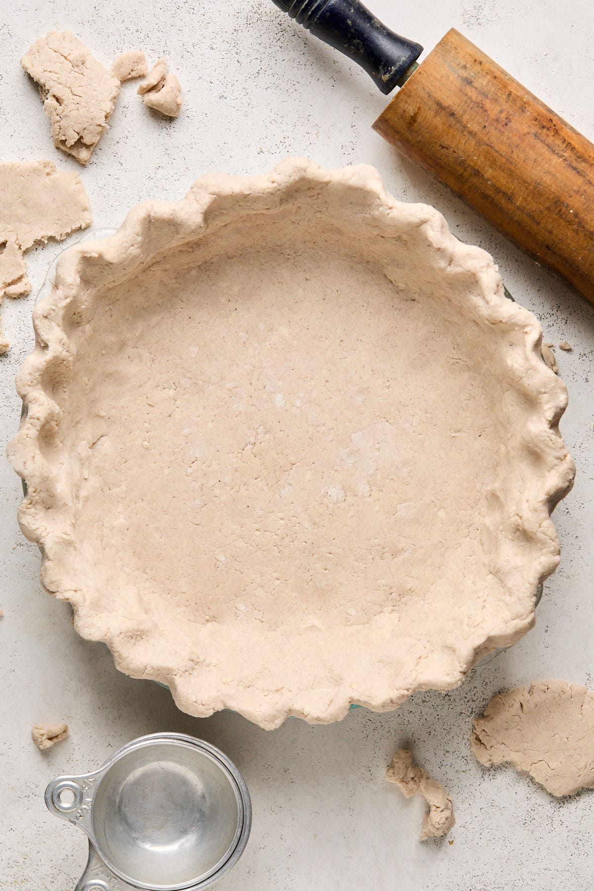 an unbaked gluten-free pie crust in a pie plate