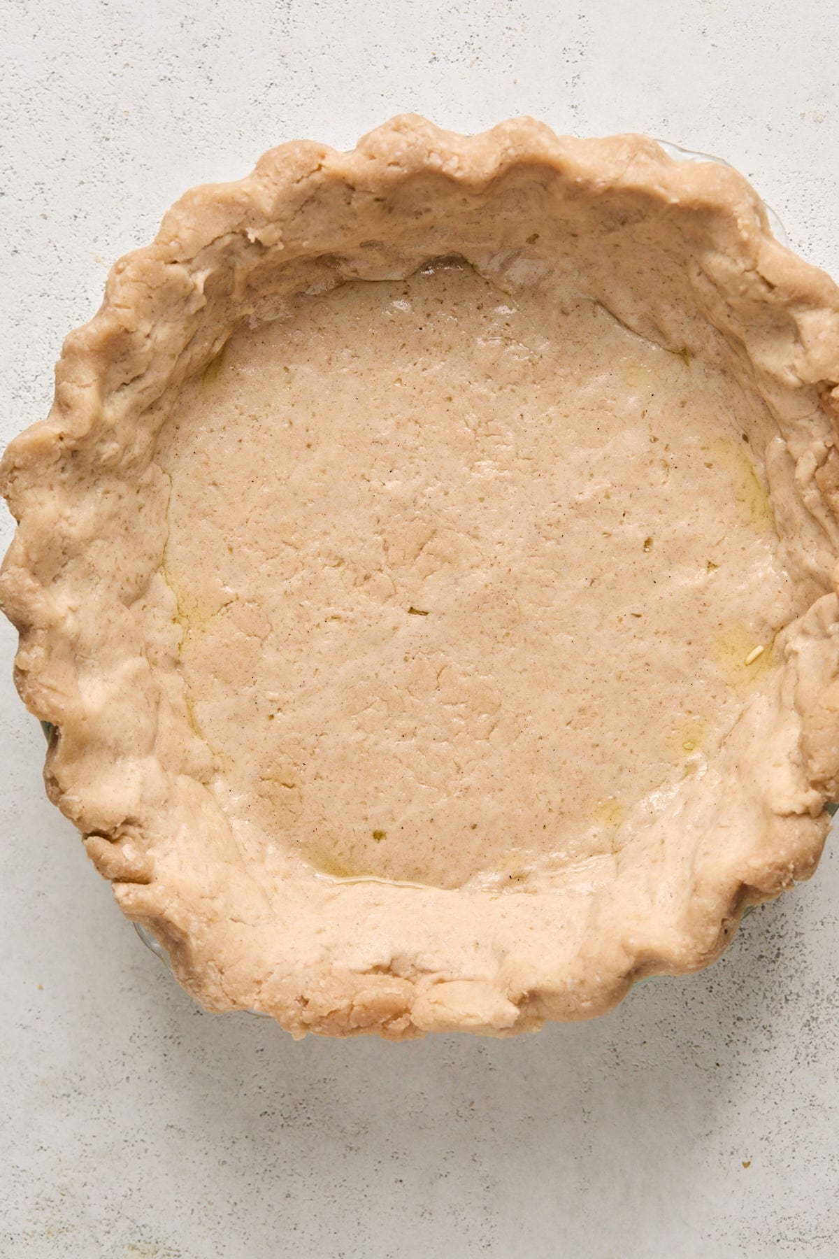 a baked gluten-free pie crust in a pie plate 