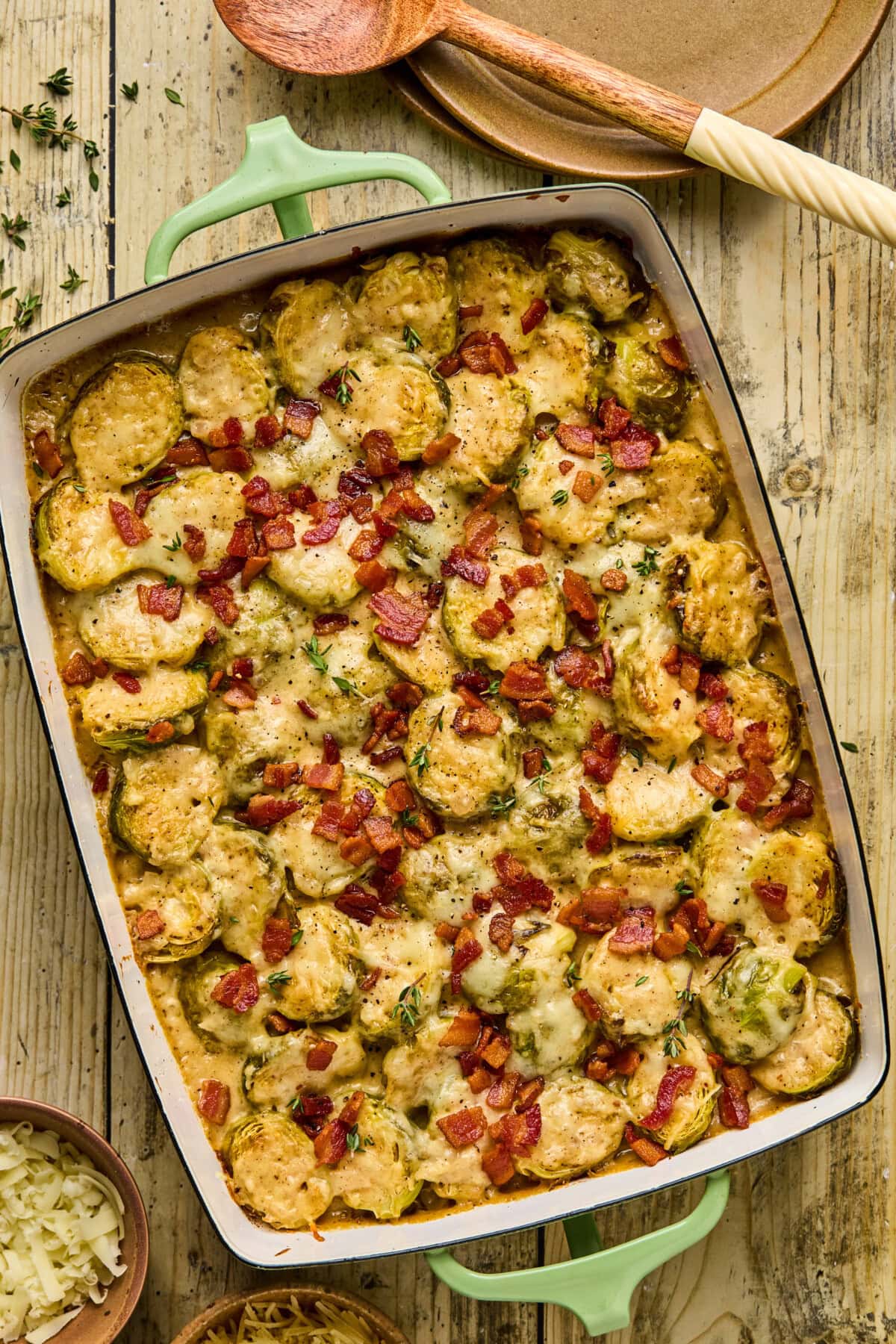 an overhead shot of a baking dish filled with a baked brussels sprouts gratin. 