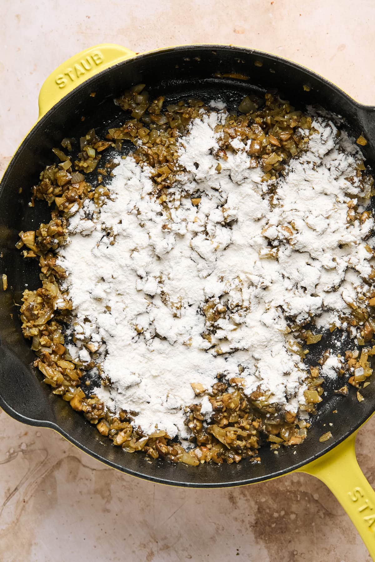 a dusting of flour over the cooked veggies in the pan. 