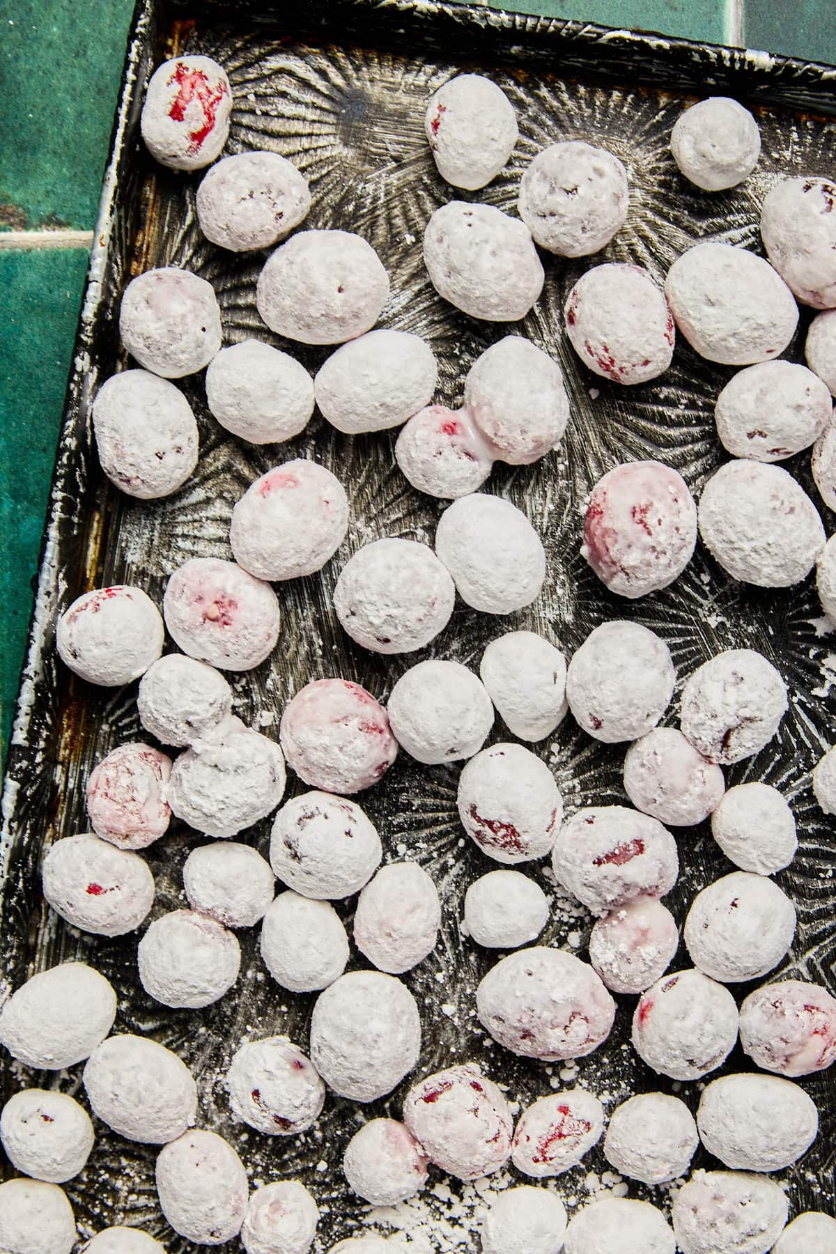 a baking sheet covered in candied cranberries