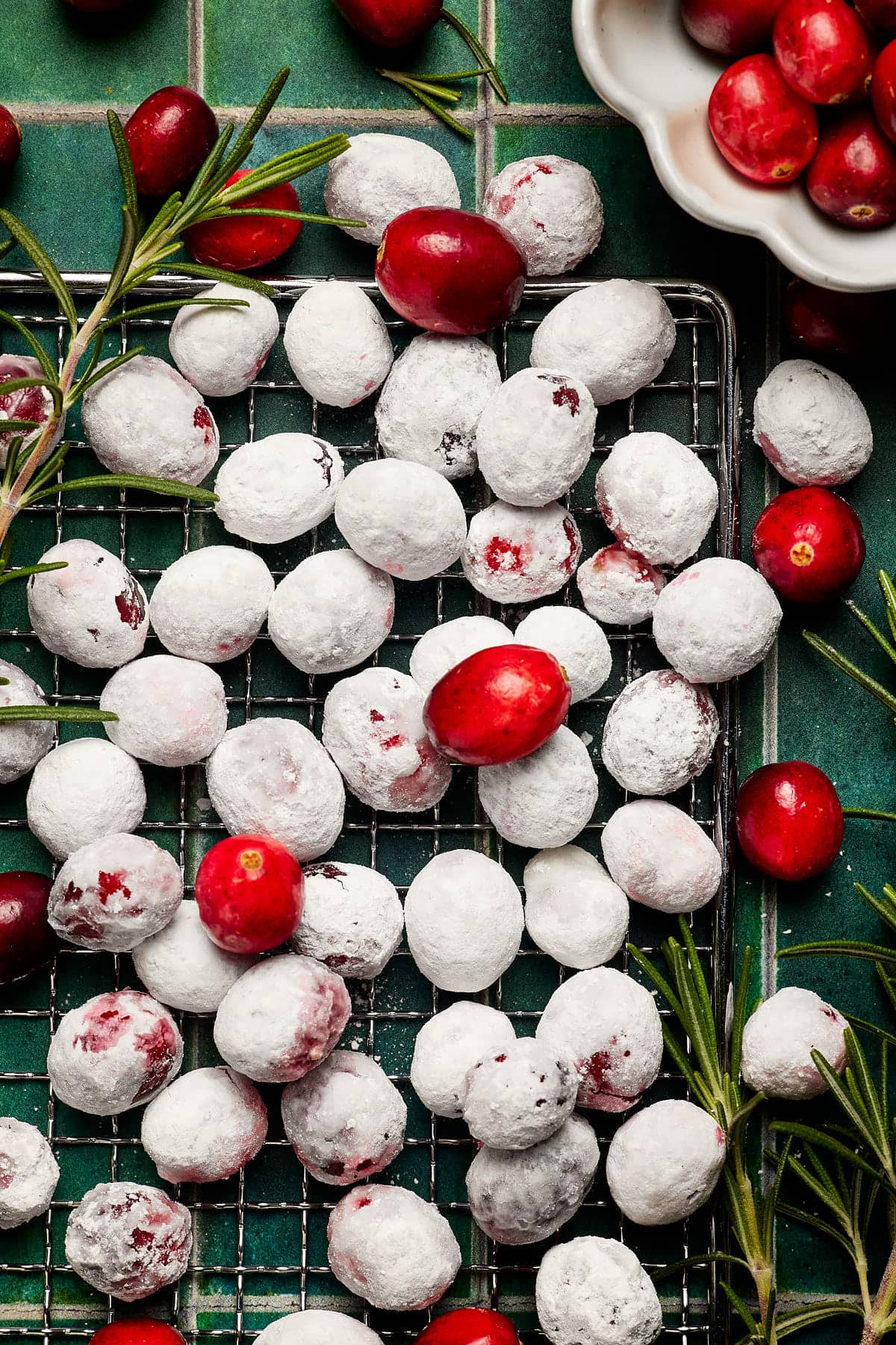 red fruit coated in powdered sugar and cooling on a wire rack