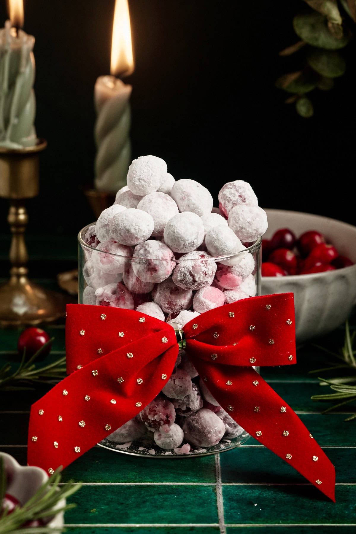 candied cranberries in a jar with a bow on the front 