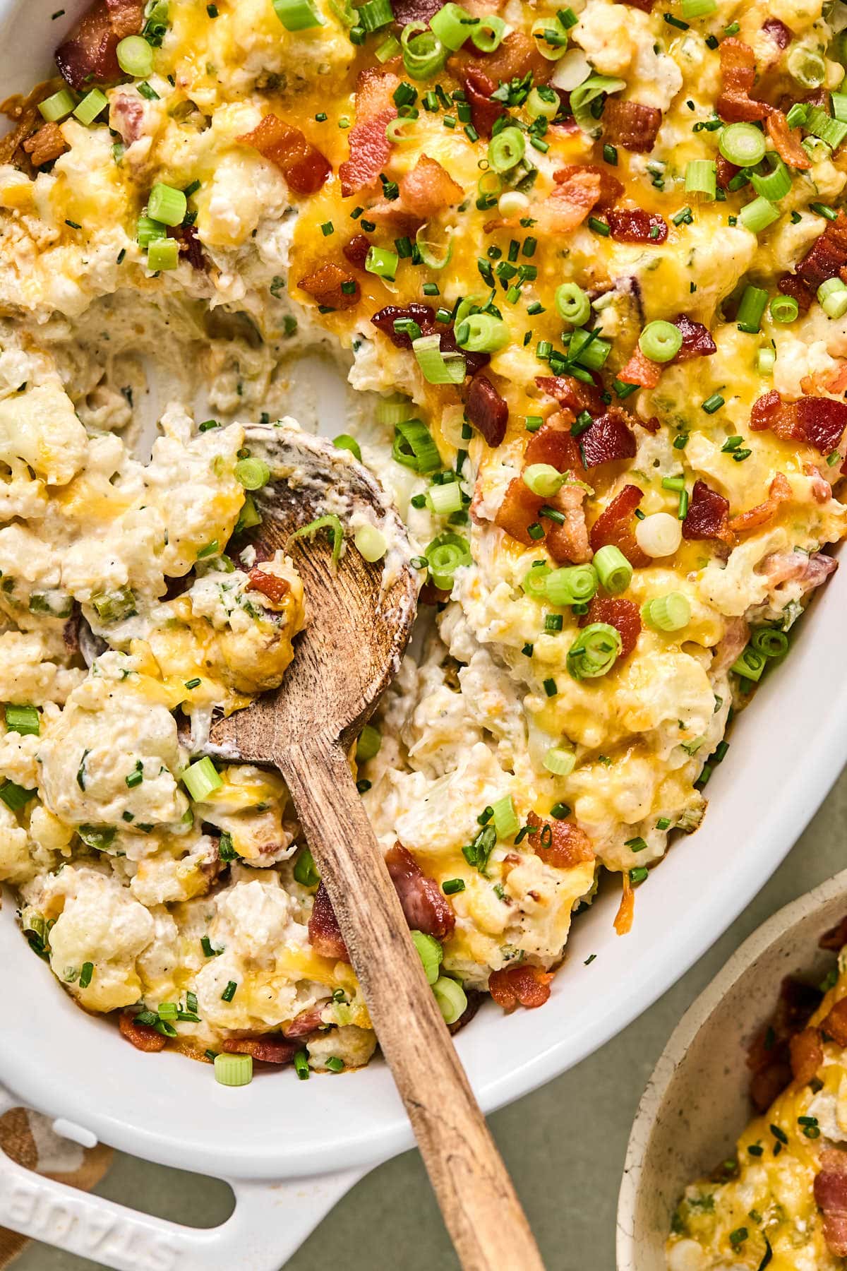 a spoon scooping out a serving of loaded cauliflower casserole 