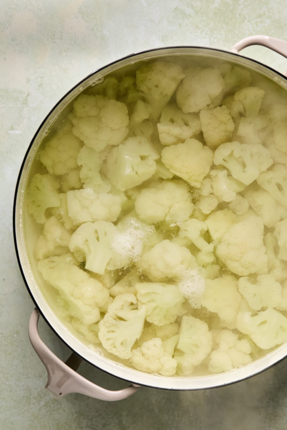 cauliflower in a pot of water