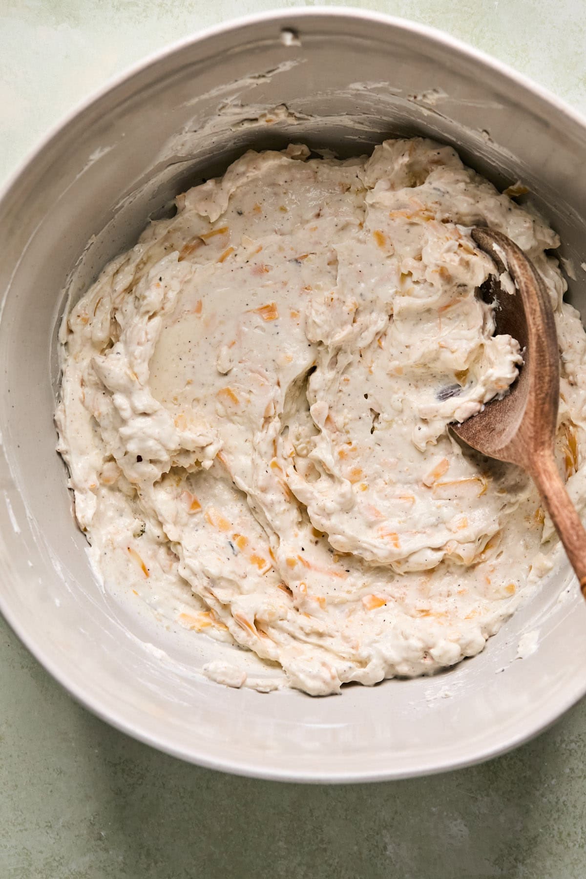 cream cheese and cheese combined to make the sauce in a large bowl