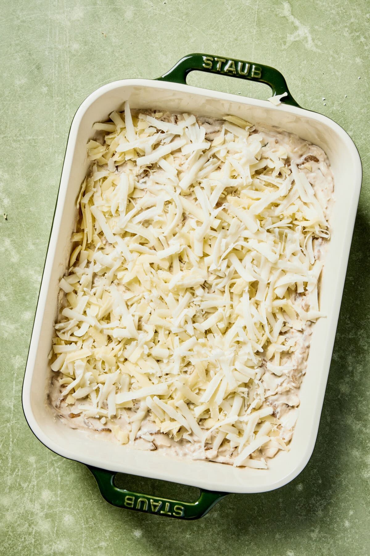 dip in a casserole dish topped with mozzarella cheese