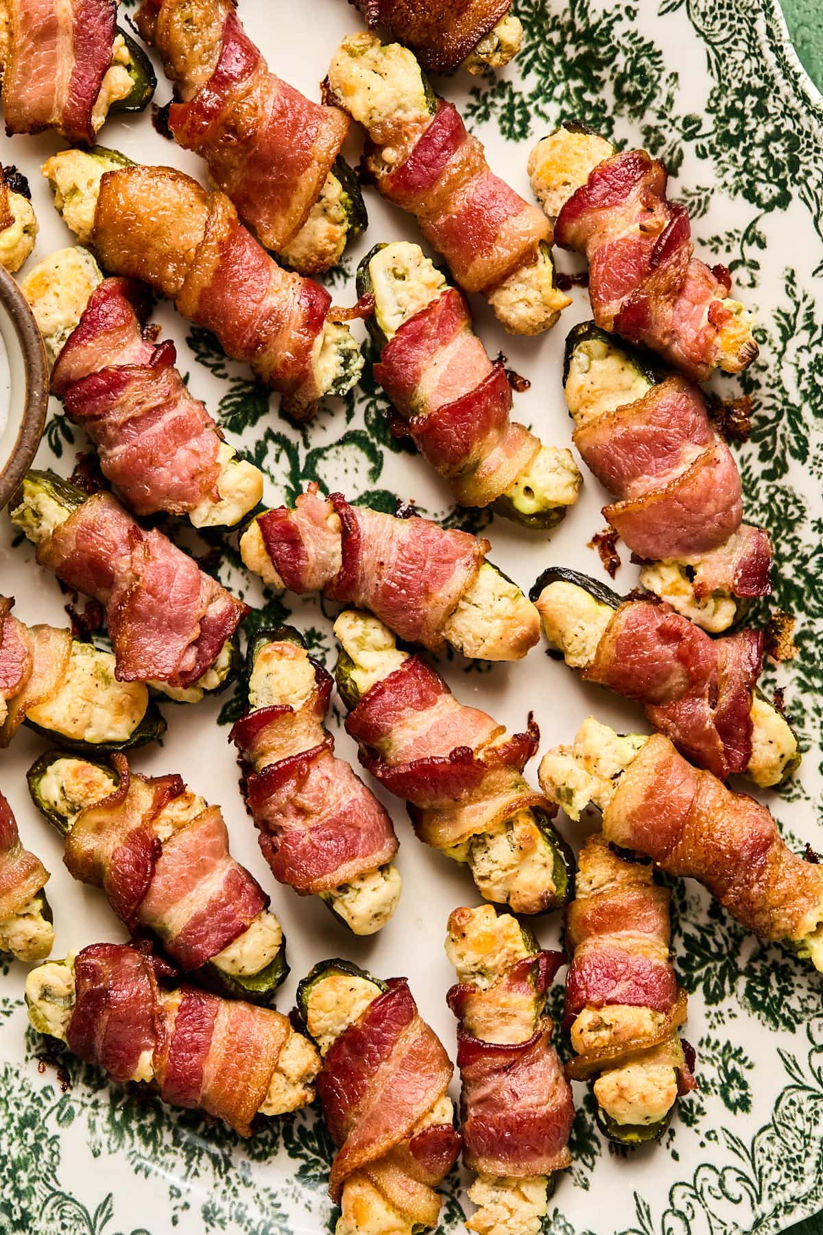 bacon wrapped pickle poppers stuffed with cream cheese 