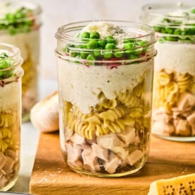 high protein chicken alfredo in a mason jar.
