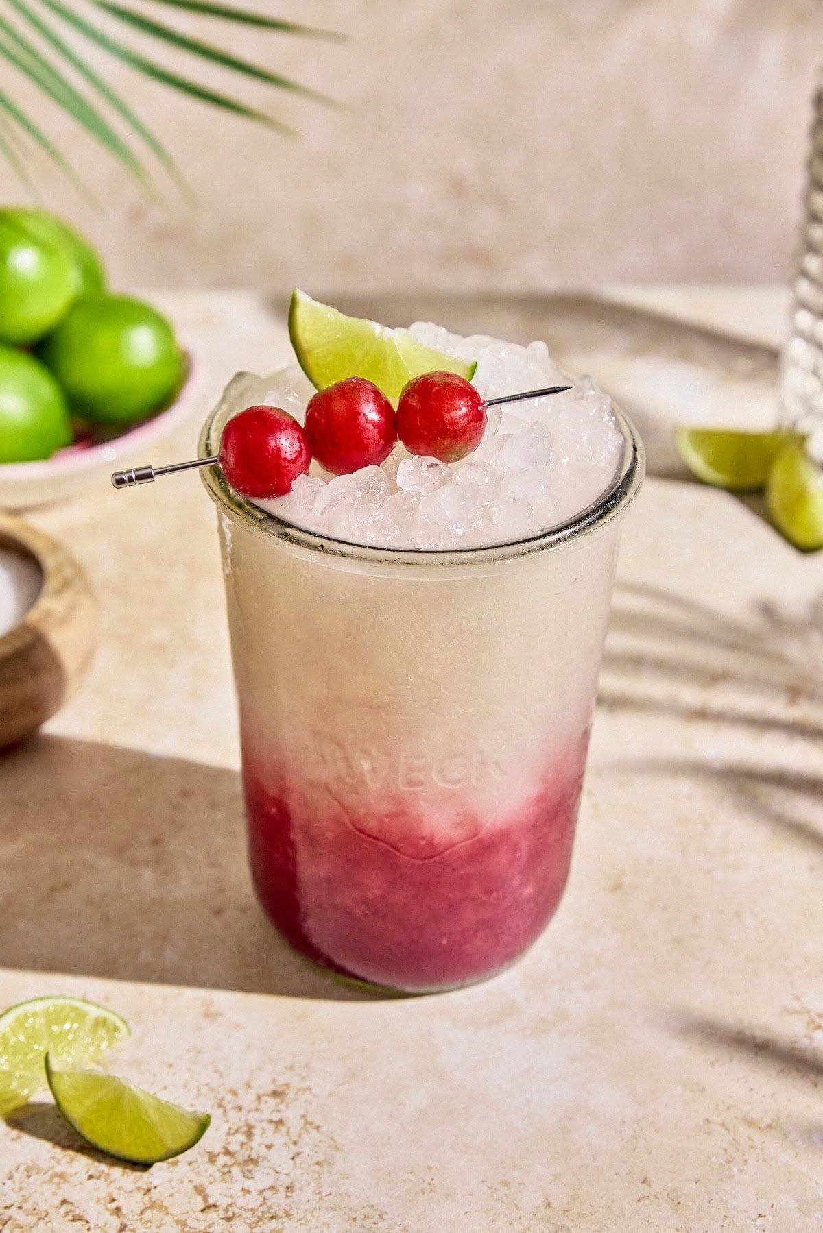 purplze haze gatorade in a glass mason jar garnished with red grapes