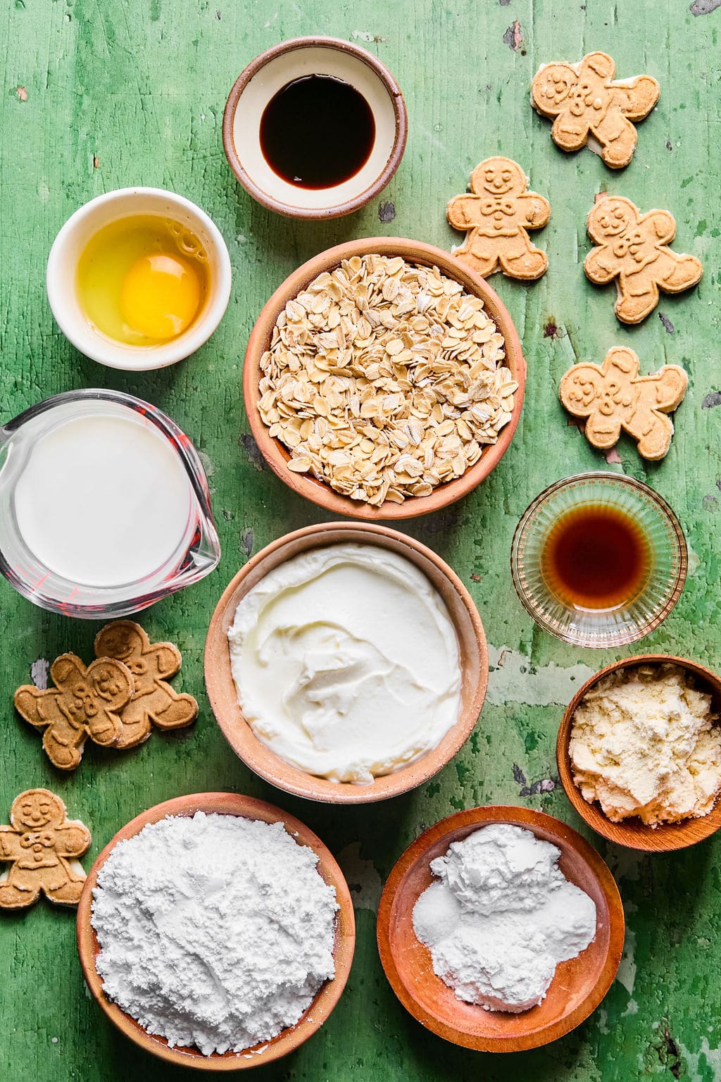 Gingerbread pancake recipe ingredients laid out on a green countertop. 
