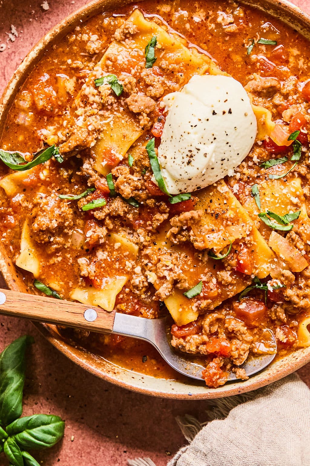 Close-up of lasagne soup recipe in a bowl with a spoon; ready to eat.
