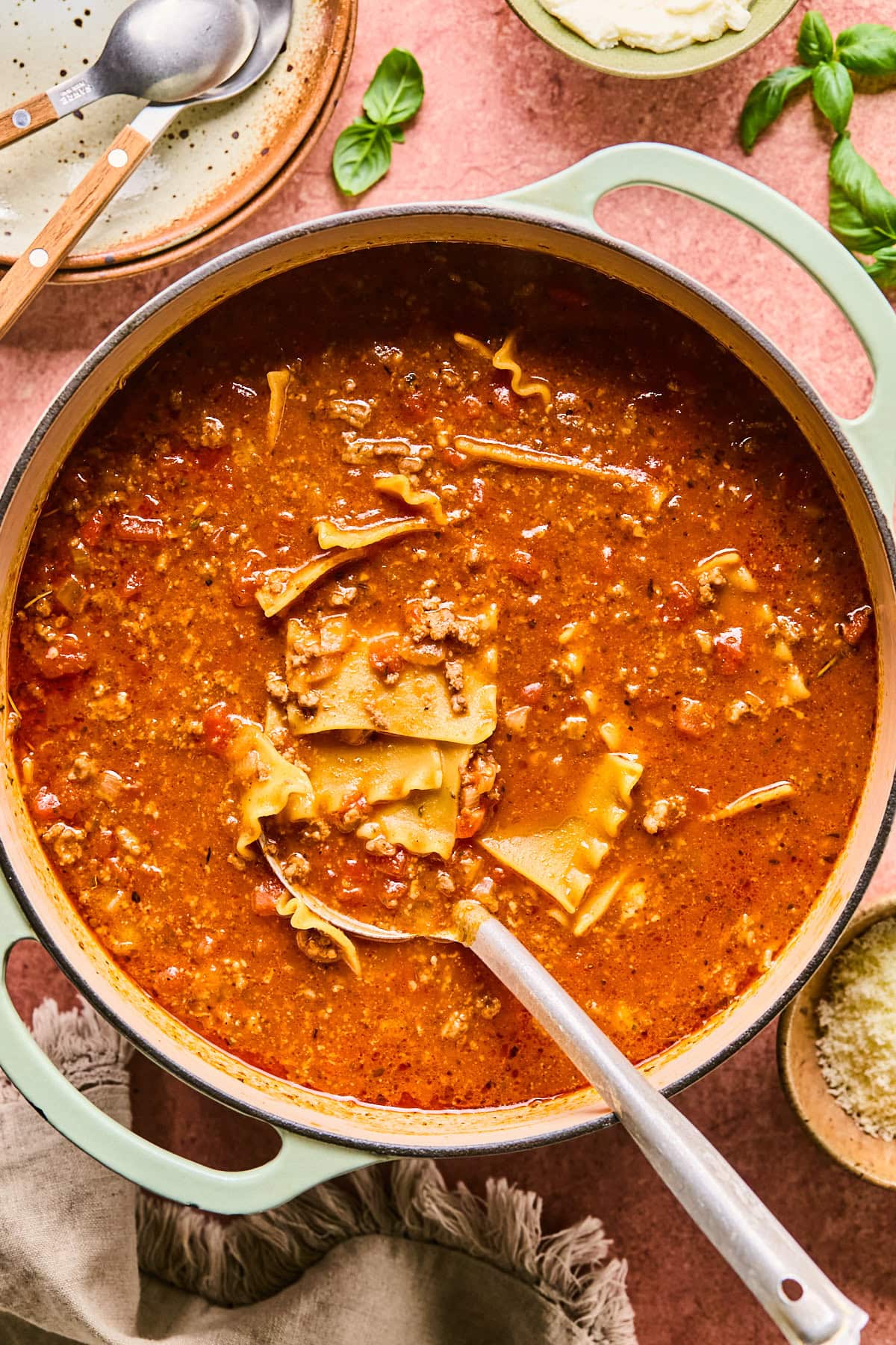 Lasagna soup recipe simmering in a large Dutch oven.
