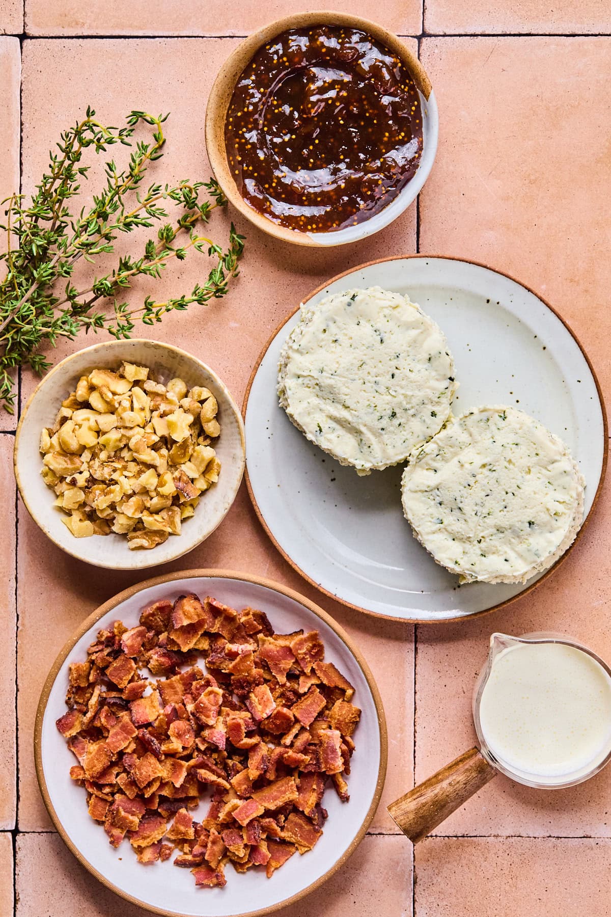 Boursin dip recipe ingredients laid out in bowls on a tiled countertop.