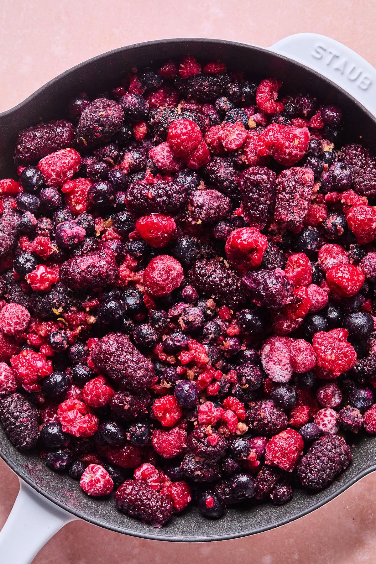 frozen berries in a cast iron skillet