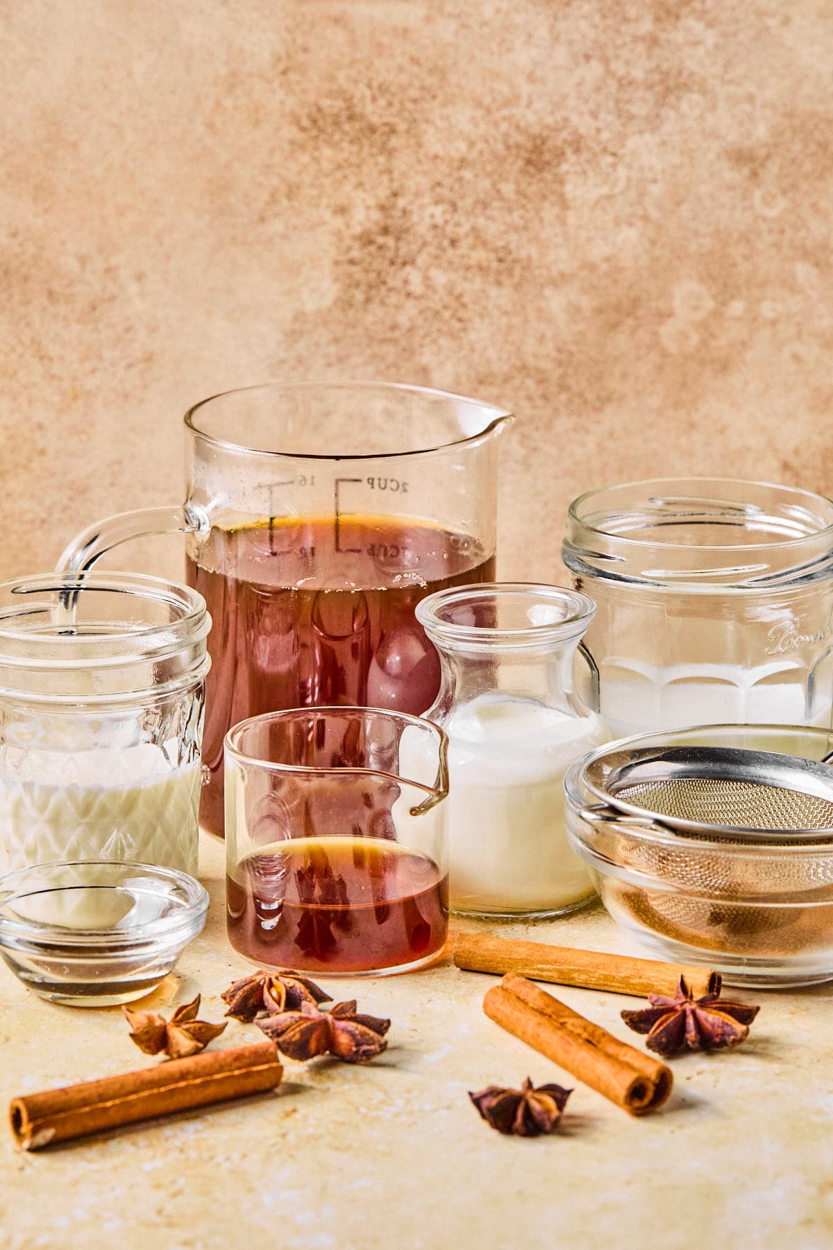 Dirty chai latte recipe ingredients laid out on a countertop.