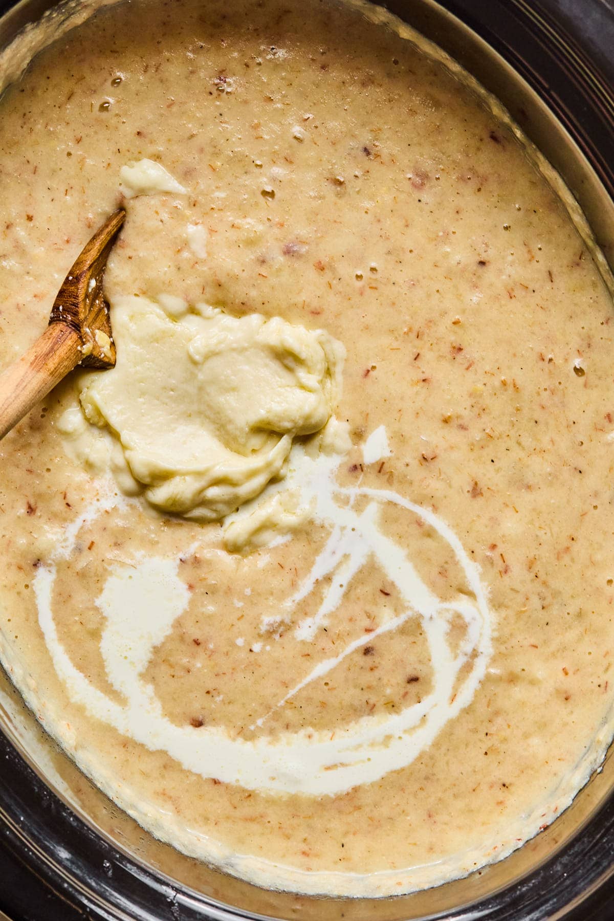 Roux stirred into crockpot potato soup with cream, sour cream, and shredded cheddar cheese.