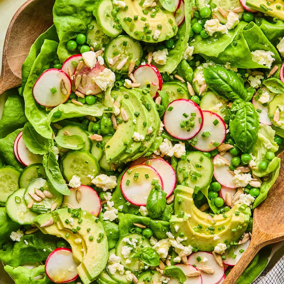 Close-up of fresh spring salad highlighting lettuce, vegetables, and toppings.