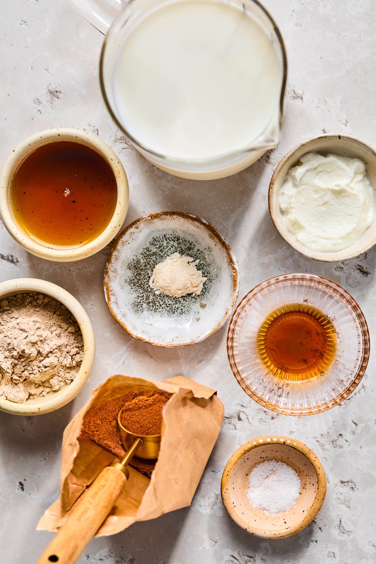 Ninja Creami chocolate ice cream recipe ingredients laid out on a light gray countertop.