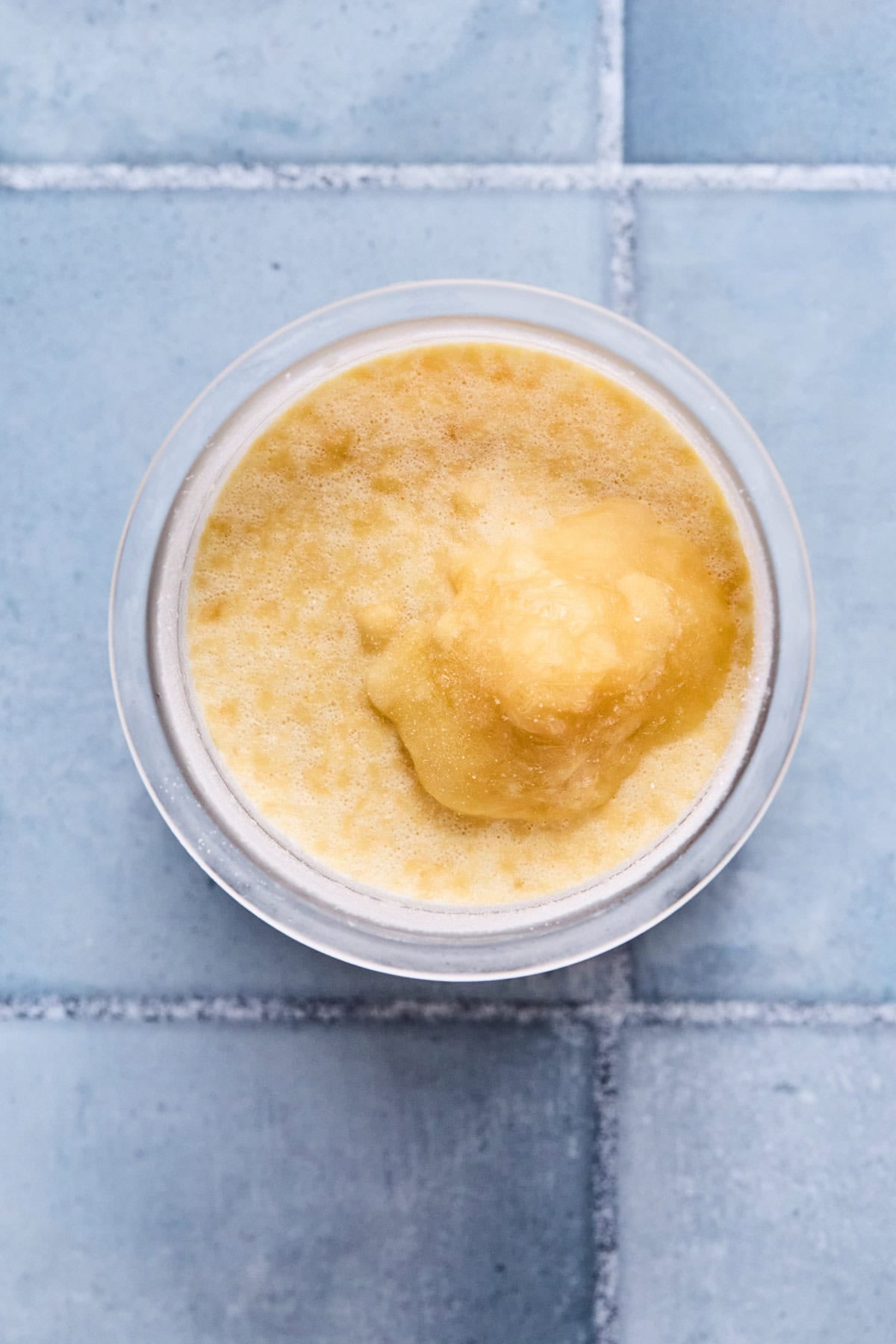 Pineapple sorbet recipe ingredients blended and frozen in a Ninja Creami pint container.