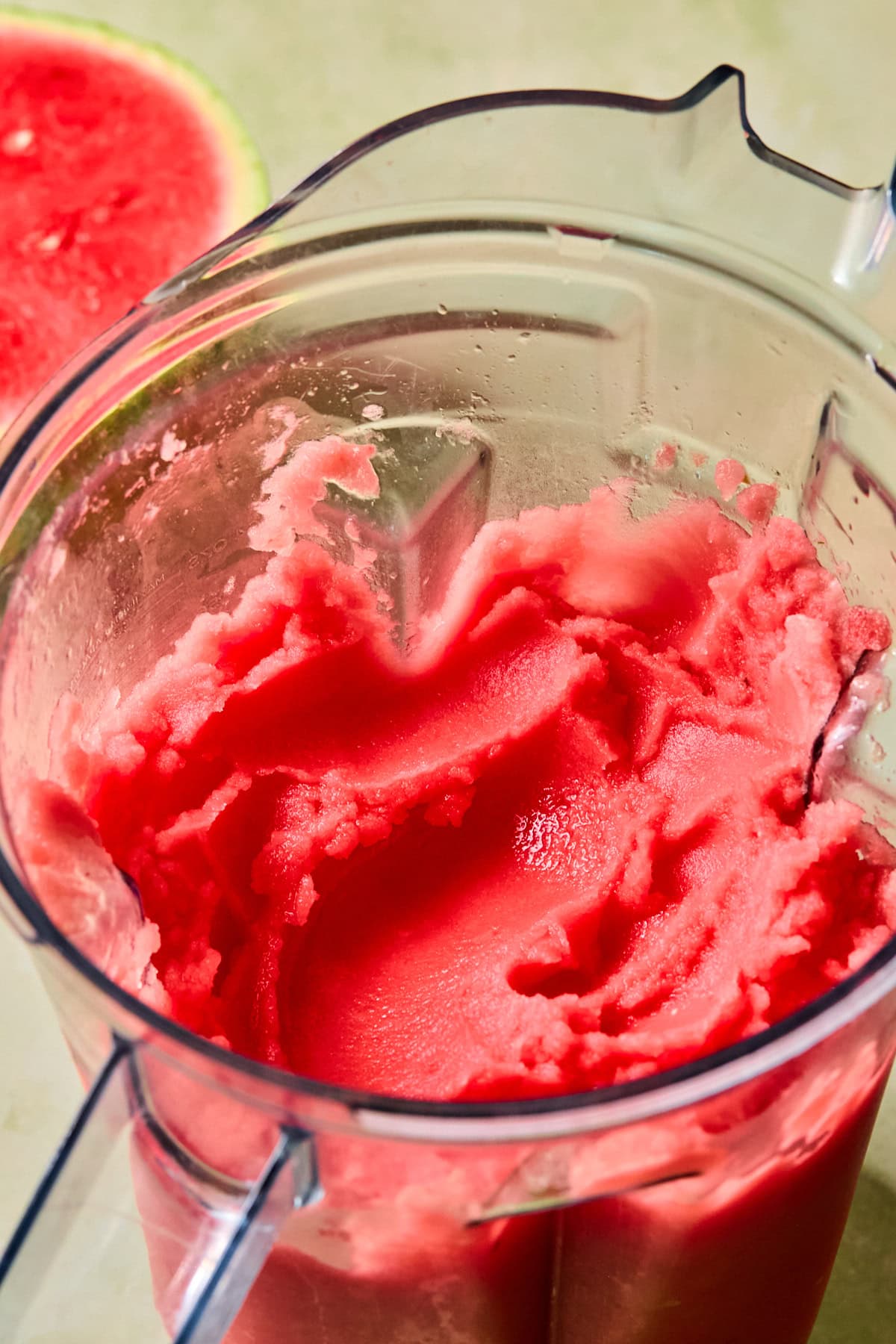Fully blended frozen watermelon, cooled jalapeño honey syrup, fresh lime juice, tequila, and ice in a high-speed blender.