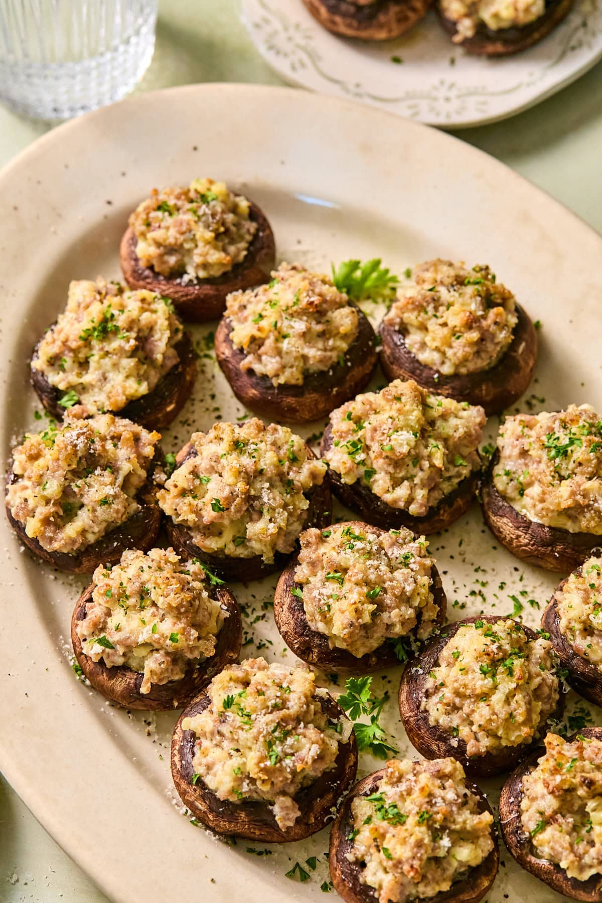 Sausage stuffed mushrooms on a serving platter.
