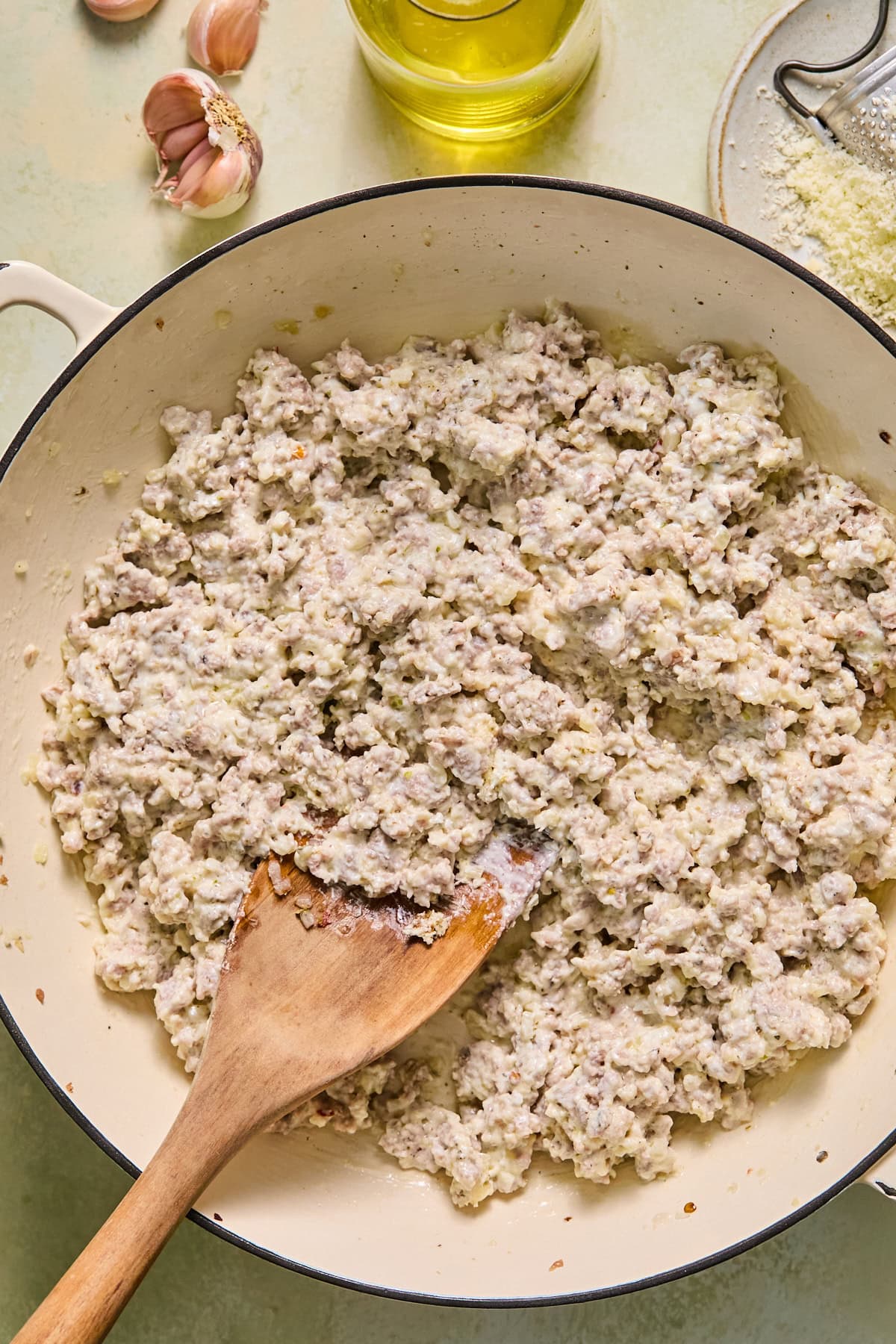 Cooked sausage and onion mixture combined with cream cheese, Parmesan, Worcestershire sauce, Italian seasoning, salt, pepper, and breadcrumbs.
