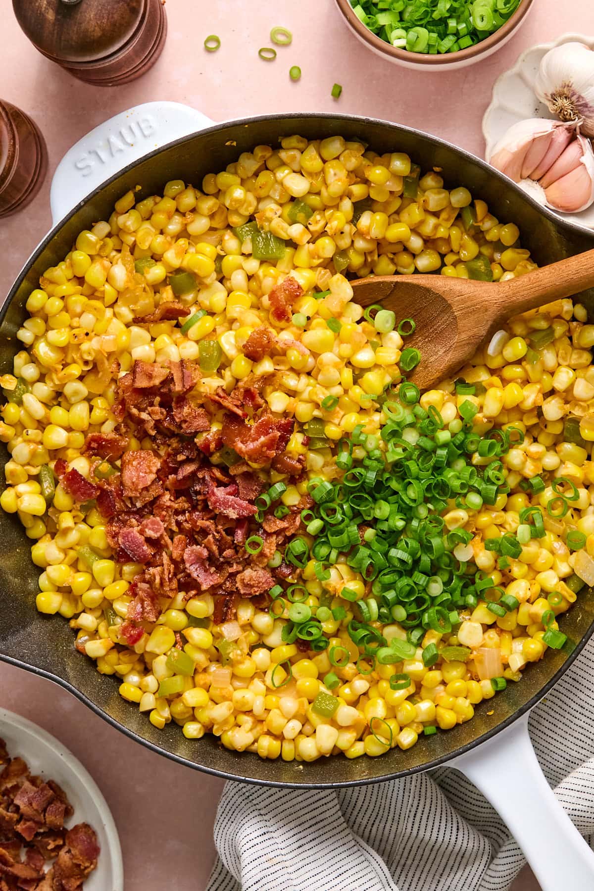 Green onions and crumbled bacon stirred into the fried corn.