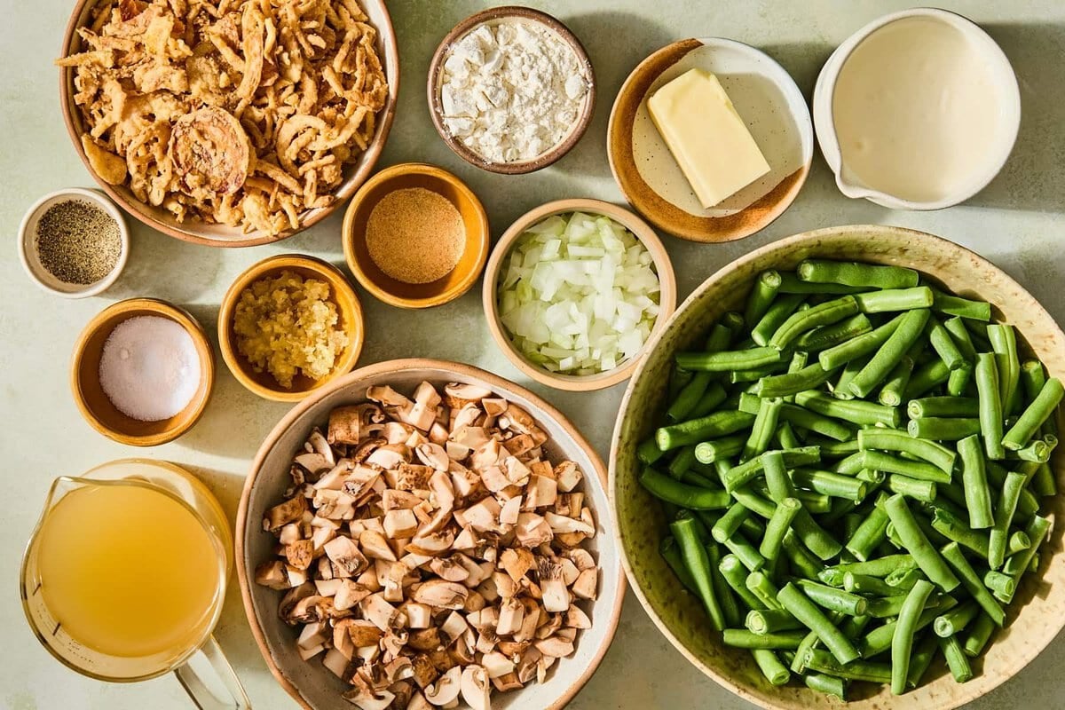 A flat lay of green bean casserole recipe ingredients so the whole thing can be made from scratch.