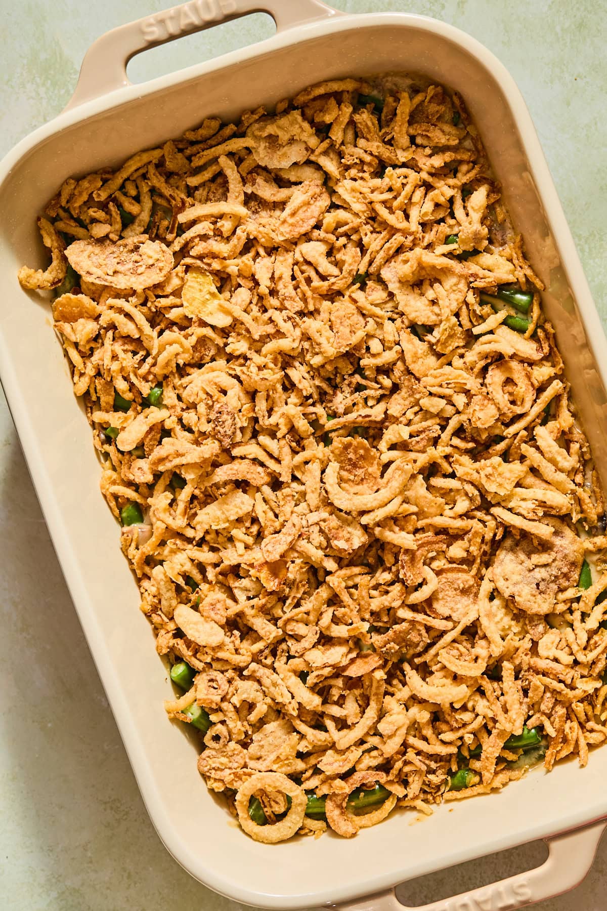 Crispy fried onions on top of the baked green bean casserole.